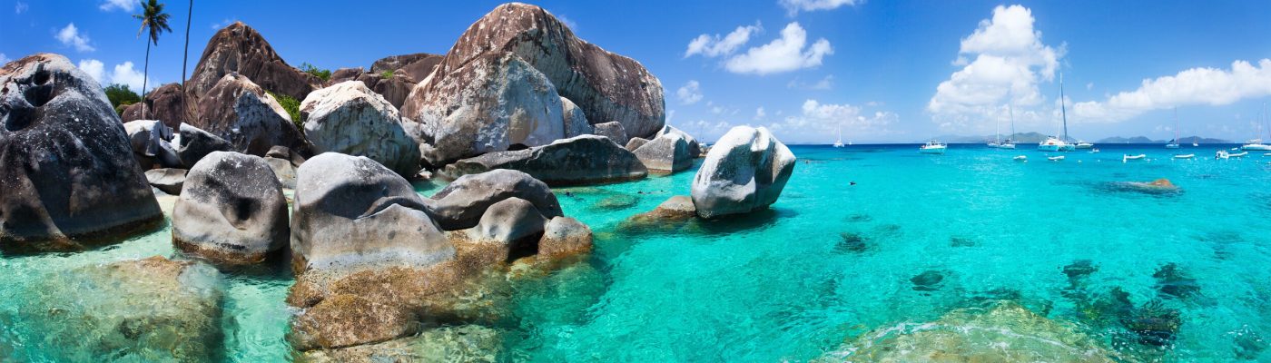 The Baths beach area major tourist attraction at Virgin Gorda, British Virgin Islands with turquoise water and huge granite boulders