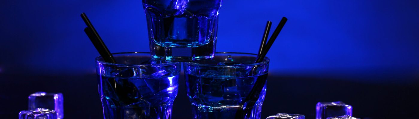 Glass of cold blue cocktail