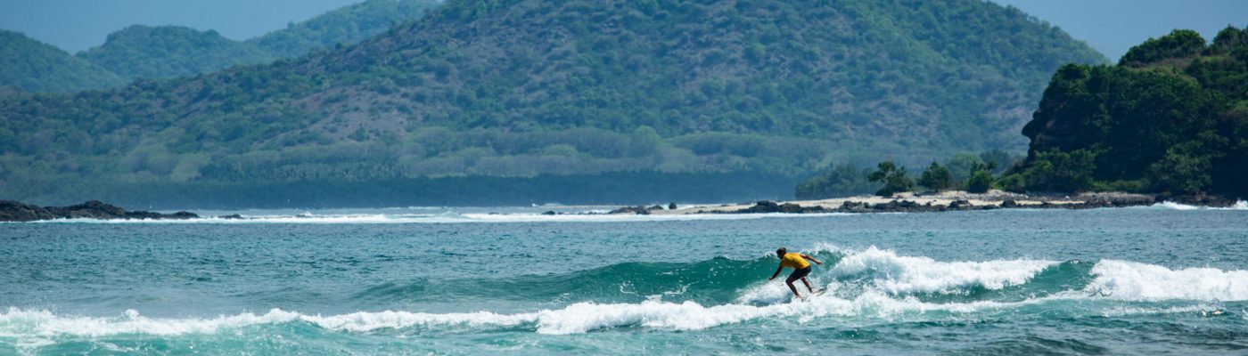 surfer on a blue wave. high quality photos